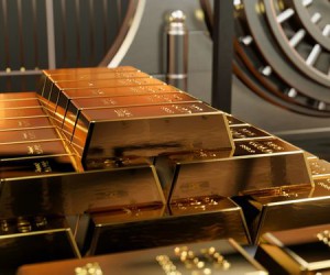Курс золота продолжает торговаться под давлением политики ФРС